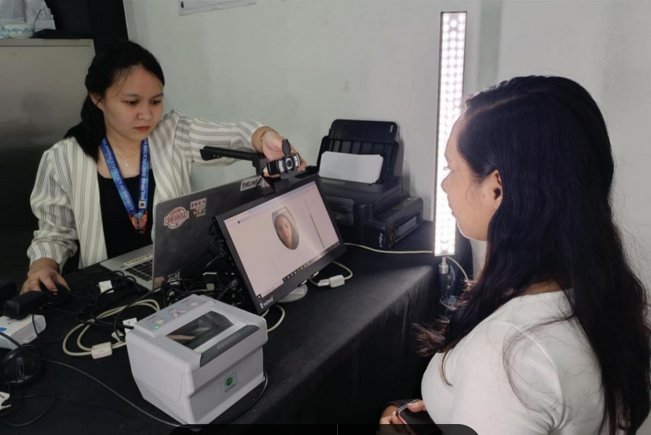 A registration officer captures the client's front-facing image as a requirement for generating the digital National ID